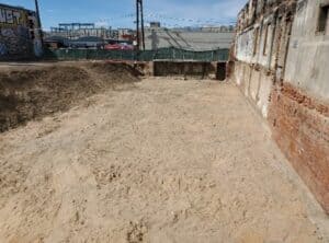 Excavation site prepared for environmental remediation and construction projects.